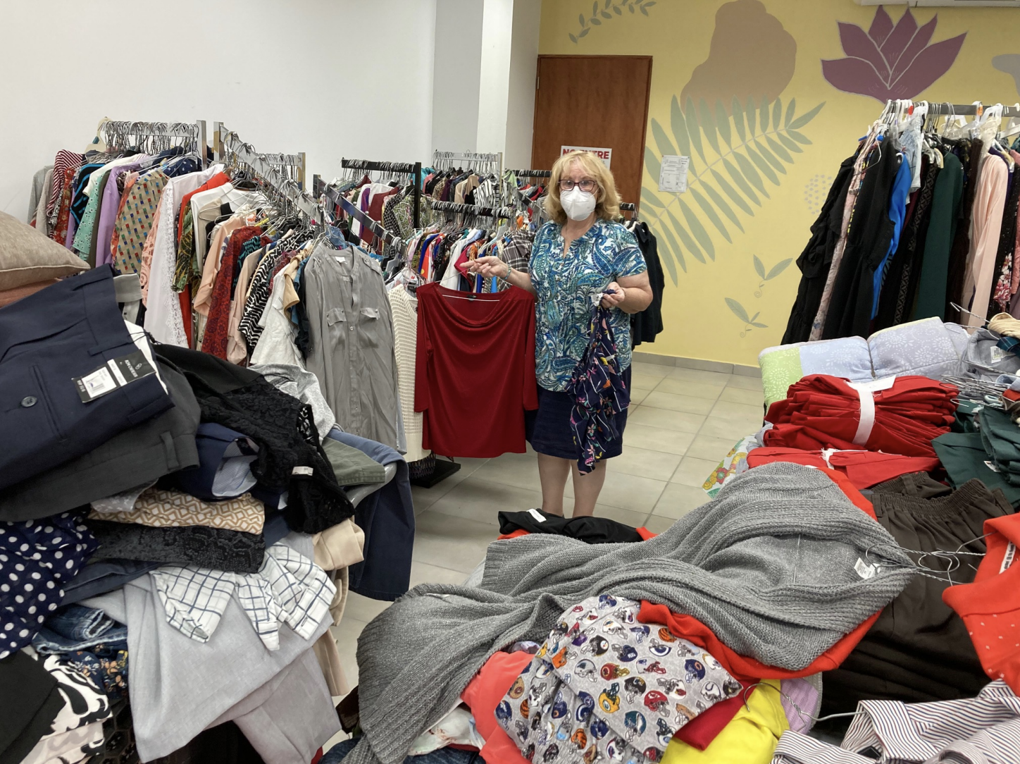 Jean Knight - Hermandad Secratary sorting clothes at CorMA